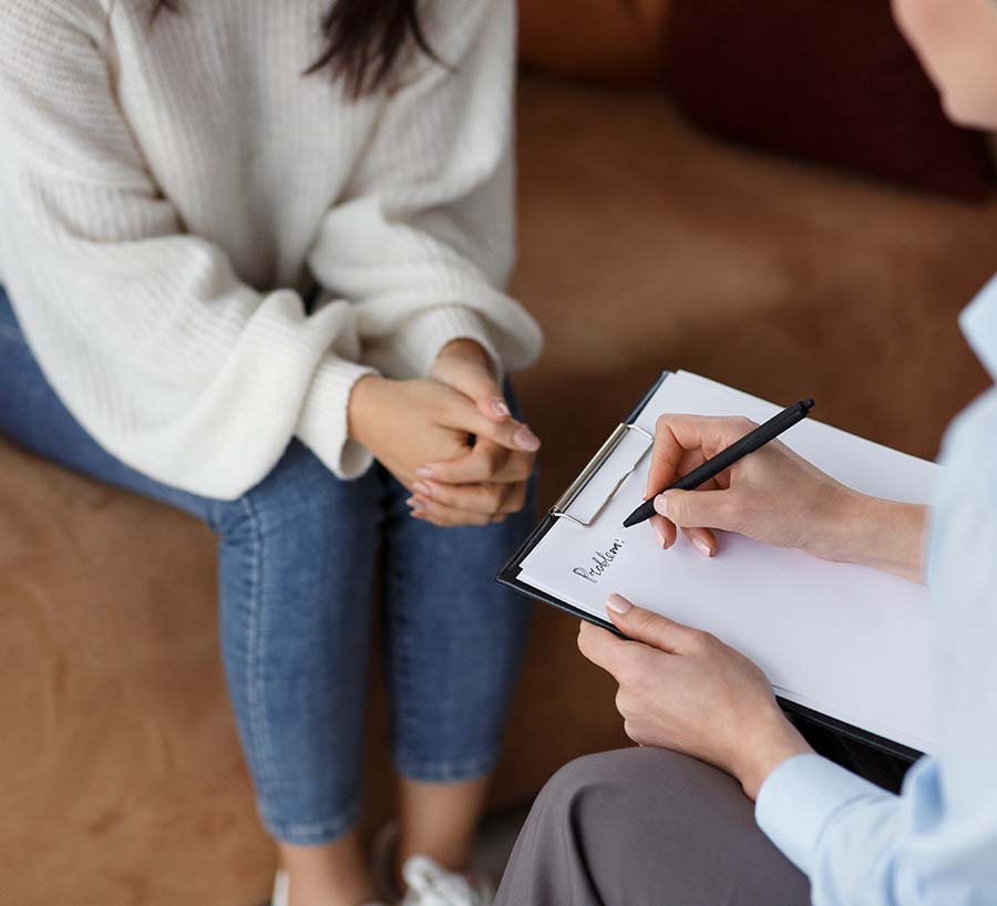 Doula Talking With Client Taking Notes